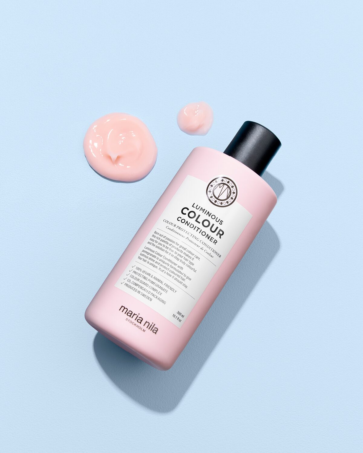 Maria Nila Luminous Colour Conditioner 300 ml geopende fles met textuur